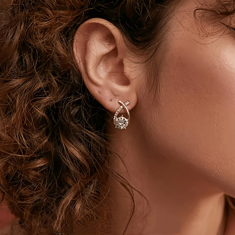Puces d'oreilles croix dorée avec zircons