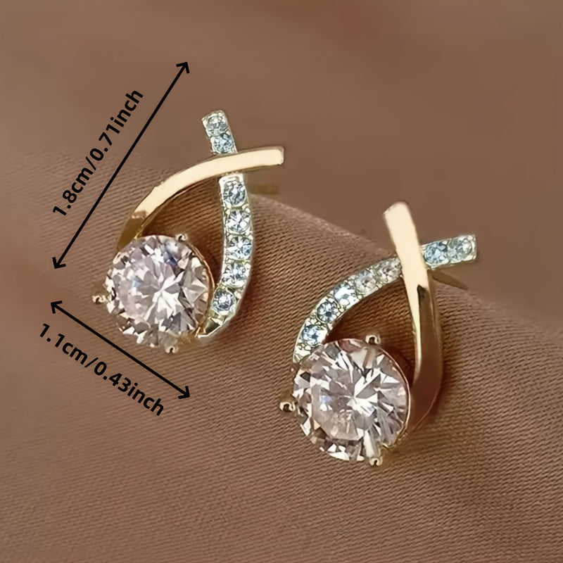 Puces d'oreilles croix dorée avec zircons