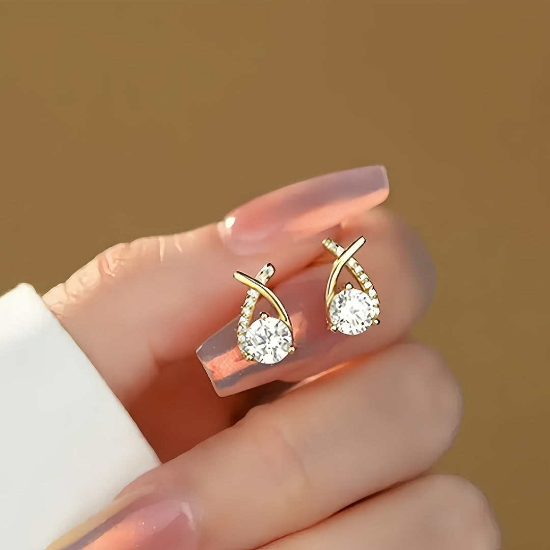 Puces d'oreilles croix dorée avec zircons