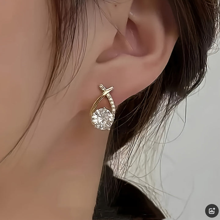 Puces d'oreilles croix dorée avec zircons