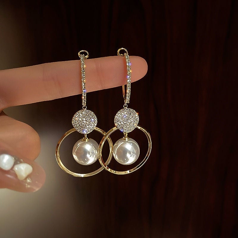 Boucles d'oreilles dorées avec perles