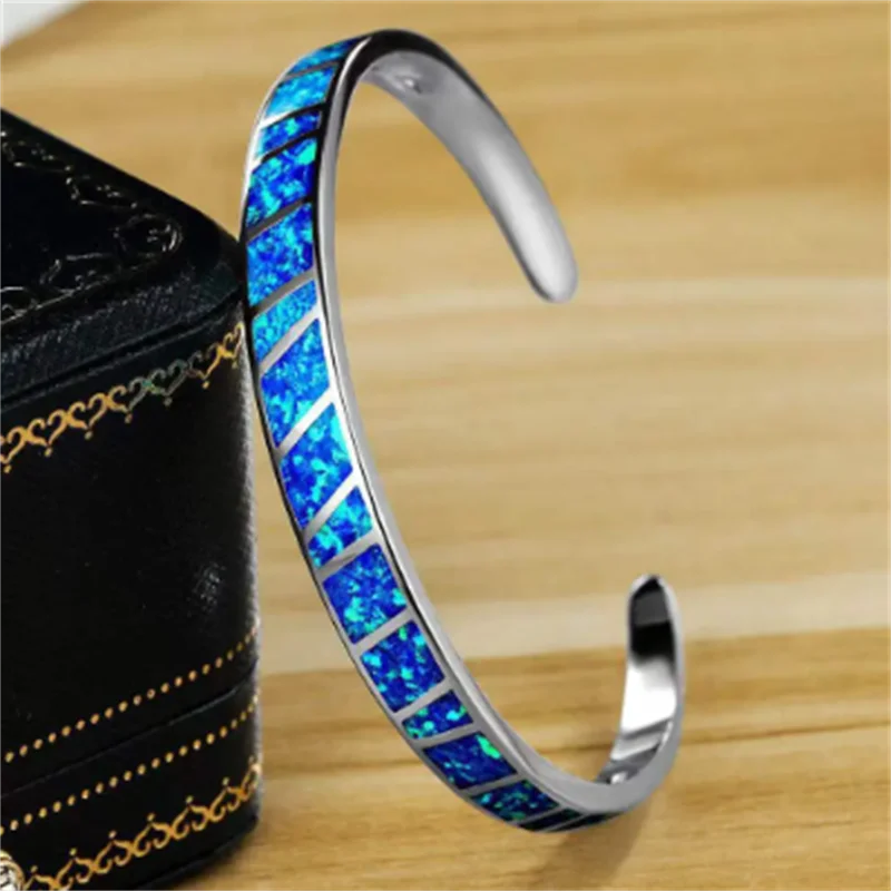 Bracelet argenté ajustable reflets d'opale bleue