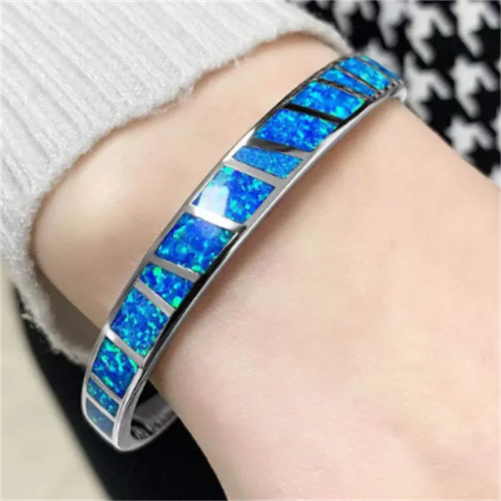 Bracelet argenté ajustable reflets d'opale bleue