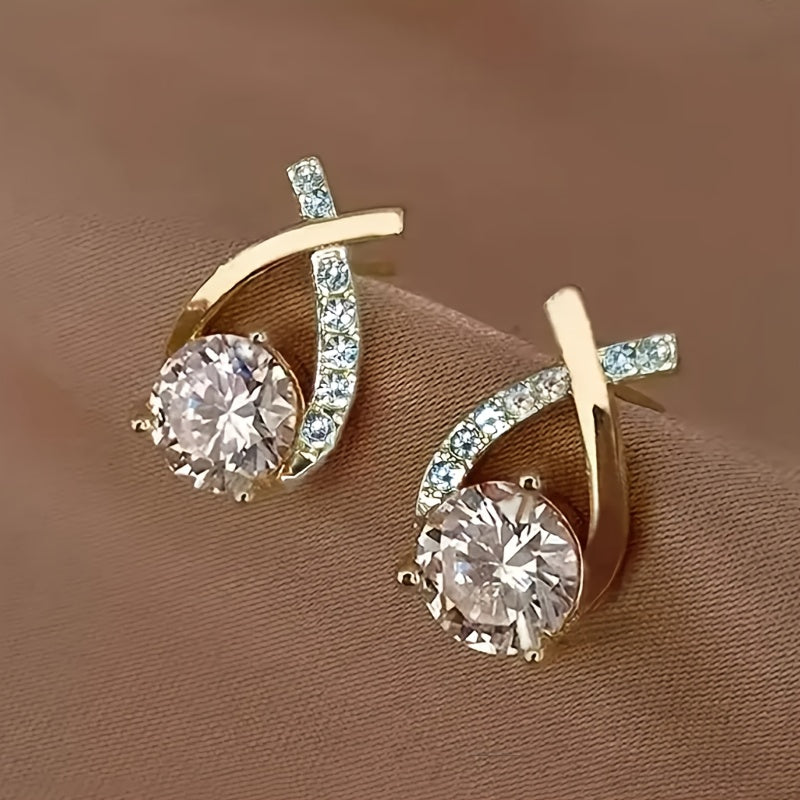 Puces d'oreilles croix dorée avec zircons