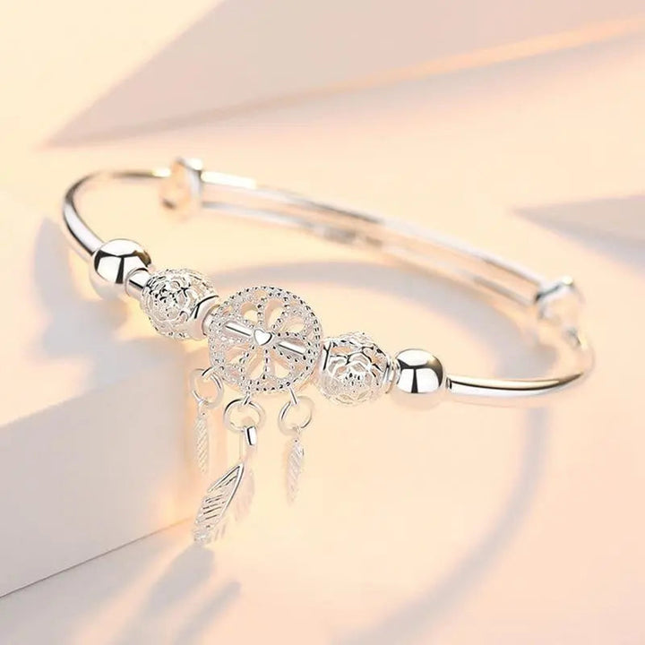 Bracelet argenté avec pendentif attrape-rêves