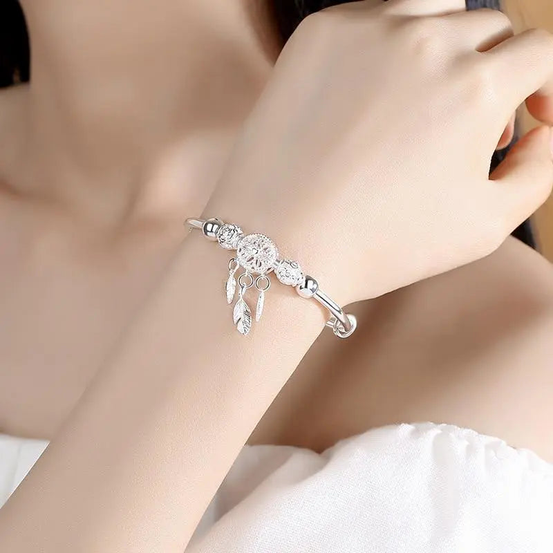 Bracelet argenté avec pendentif attrape-rêves